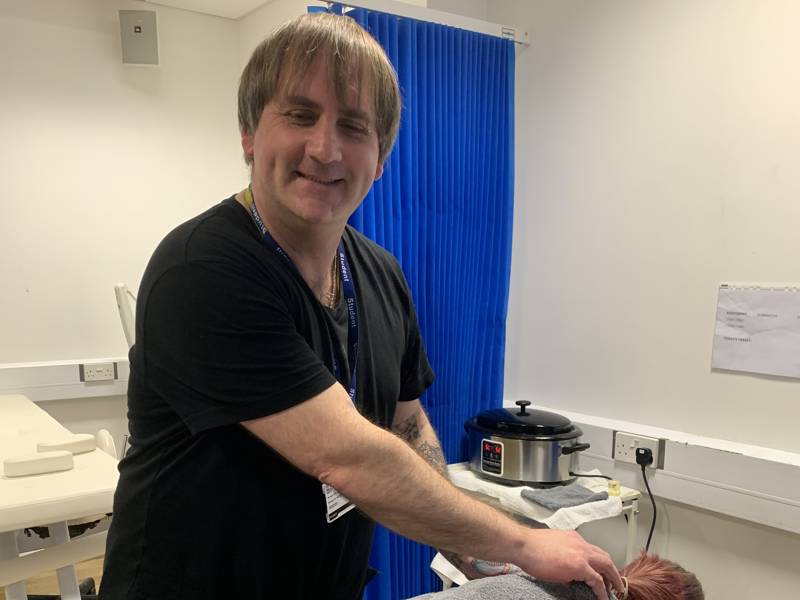 Richard Kirk in the salon during his Massage Therapy qualification.
