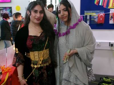 Two students pose in their traditional dress at COPC Culture Day