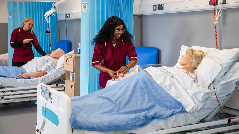 Health and Social Care student working in the Victory Health Suite at Highbury Campus