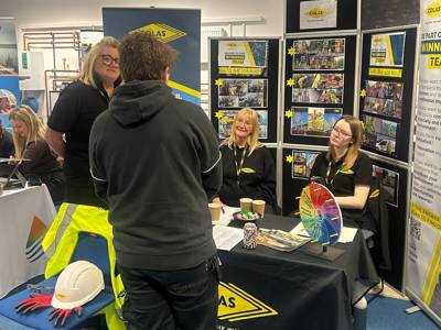 Staff from Colas chatting to a student at the Construction Careers Fair