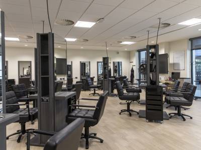 Retreat hair salon chairs and mirrors at City of Portsmouth College 