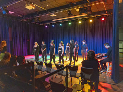 Students doing a performance in the performance theatre at City of Portsmouth College 