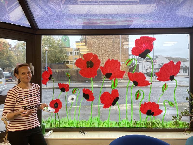 Keira with her stunning images of poppies at our Arundel Campus.