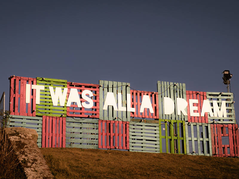 Victorious 2025 - an art installation of coloured pallets with the inscription