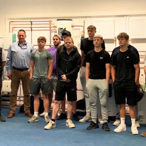 Isni Basha from Wilten Construction, far left, with staff and students from City of Portsmouth College