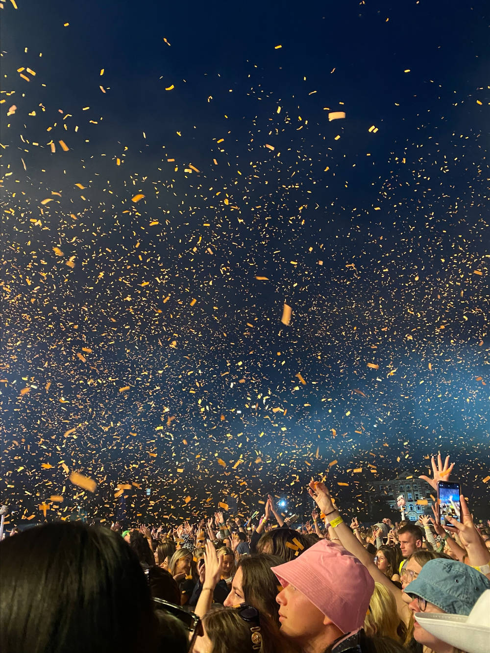Gold ticker tape over fans at Victorious Festival.